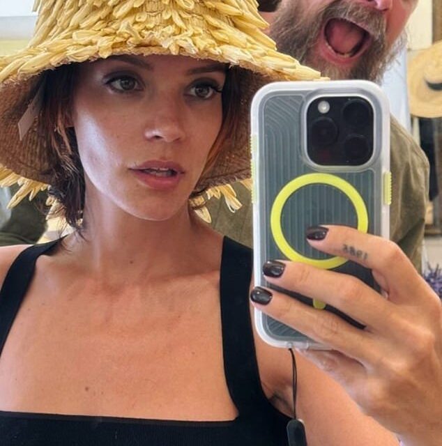 Lily Allen tries on hats with husband David Harbour in Italy