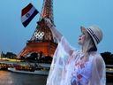 Olympic swimmer Luana Alonso holds a Paraguay flag during the Opening Ceremonies.