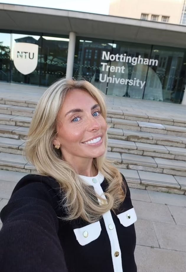 a woman taking a selfie in front of nottingham trent university