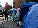 Tents line a block outside a homeless shelter at 3030 Gordon Ave. in Vancouver. 