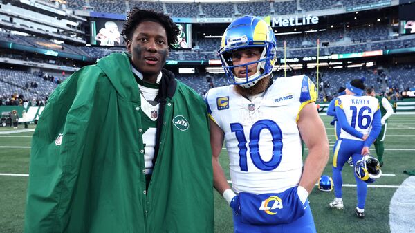 Sauce Gardner (L) talks with Cooper Kupp of Los Angeles Rams after their game at MetLife Stadium on December 22, 2024.