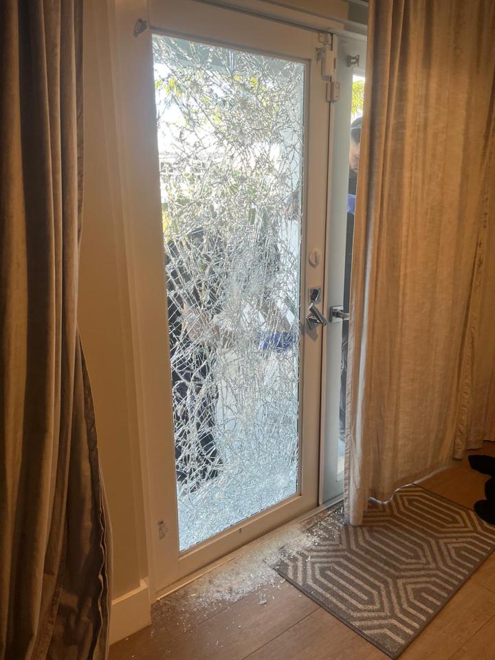 Shattered glass door at a residence.