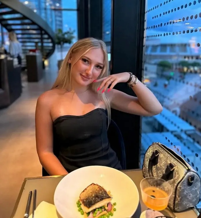 Photo of Juli Luxie at a restaurant.