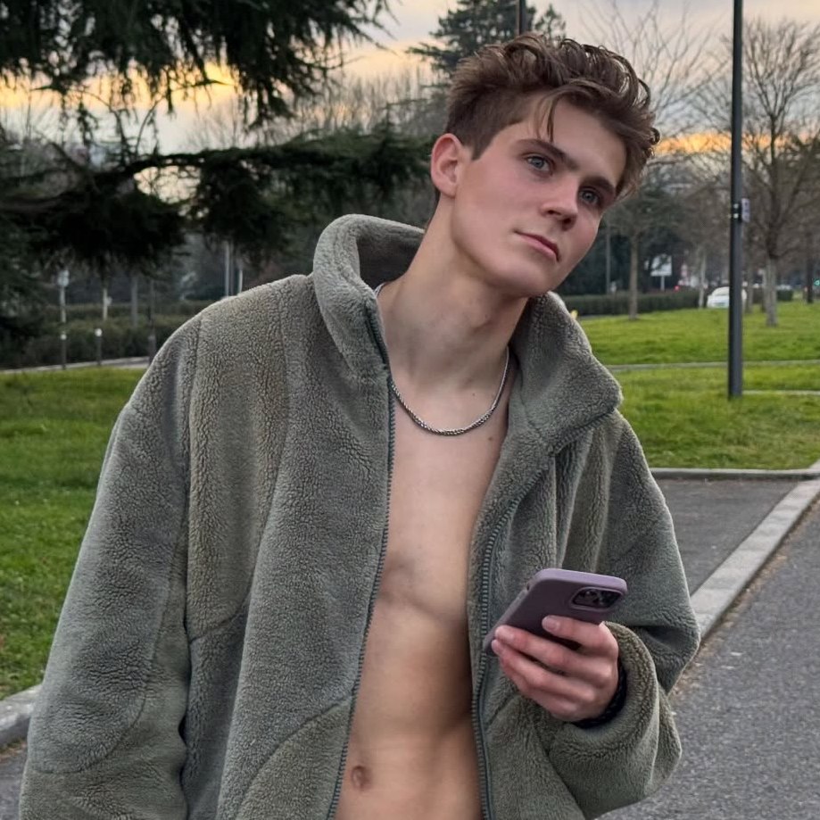 Young man using a smartphone outdoors.