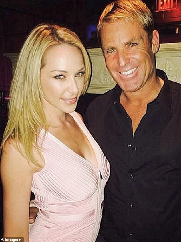 Shane Warne's glamorous ex-fiancée Emily Scott has become the latest Aussie celebrity to join OnlyFans - and she couldn't care less what anyone thinks. (Emily pictured with Shane)
